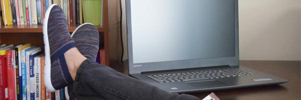 Women's Harmony Zenz in Navy on model with her feet up on a desk with a laptop in the background