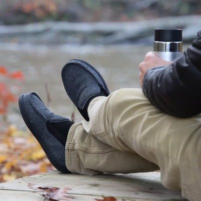 Men's Logan Herringbone Moccasin Slippers in Black on Model