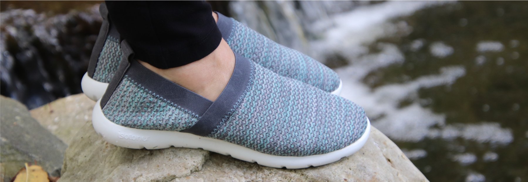 Zenz Women's Harmony Slip-On on figure on rocks by water