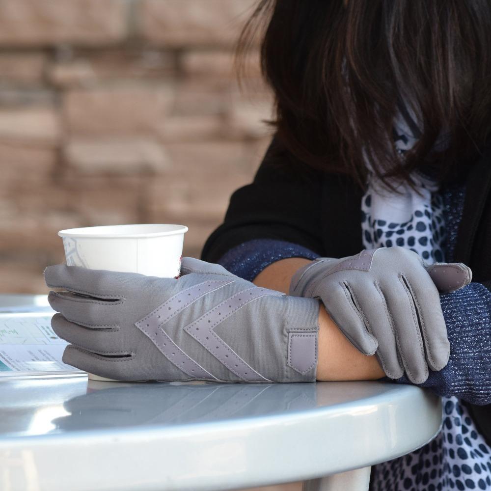 Women's Chevron Shortie Gloves in Dusty Lavender on Model sitting in a cafe holding a to-go cup