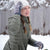 Women's Chenille Knit Fingerless Glove Cozies in Dusty Lavender on figure on top of the Dusty Lavender shortie gloves. Model is standing in the snow, adjusting her hat