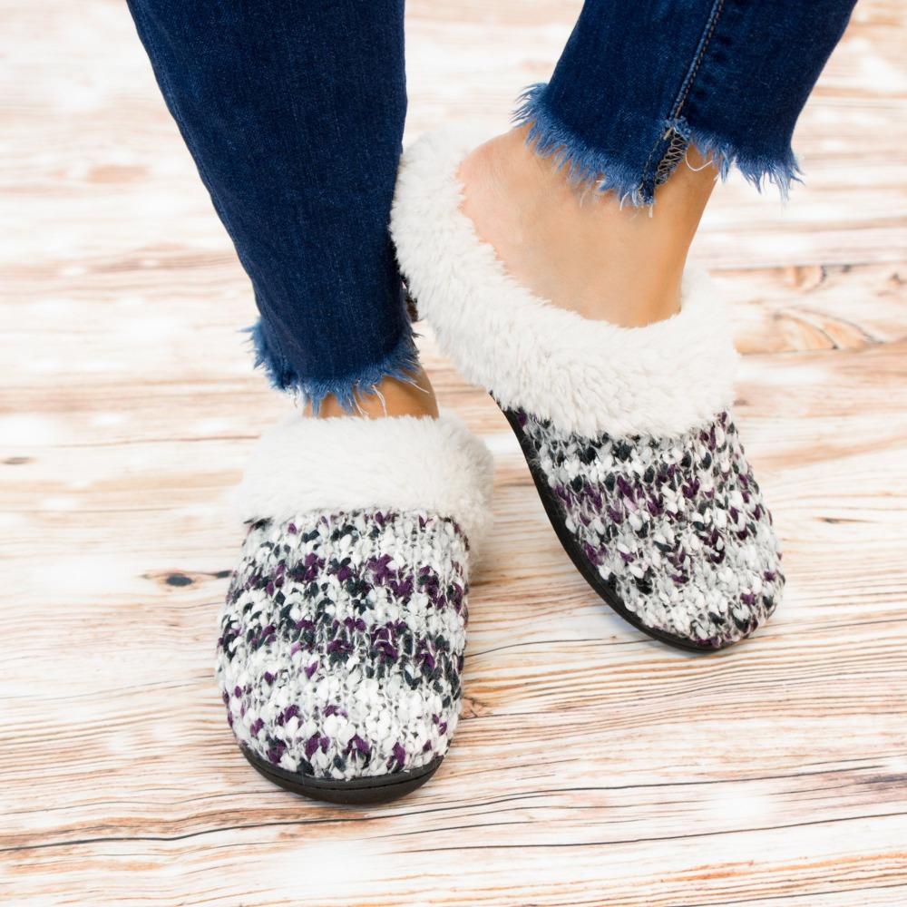 Women's Sweater Knit Amanda Hoodback Slippers in Heather with Purple on Model standing on hardwood floor
