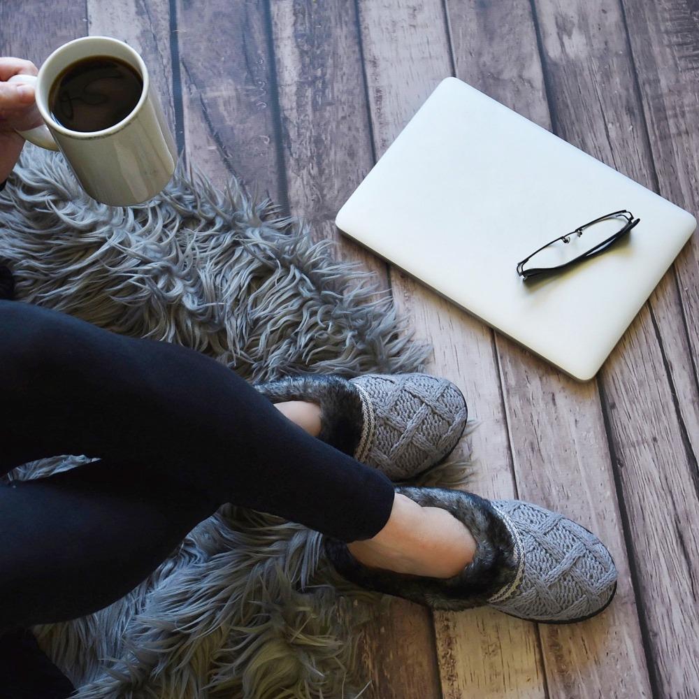 Women's Knit Tessa Hoodback Slippers in Stormy Grey On model with laptop and a cup of coffee