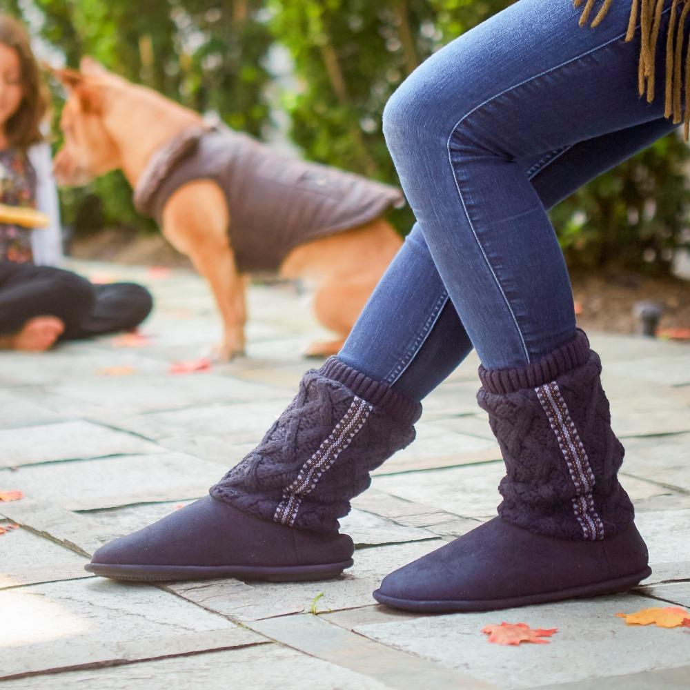 Women's Tessa Knit Tall Bootie Slippers in Navy on model outside with kid and a dog