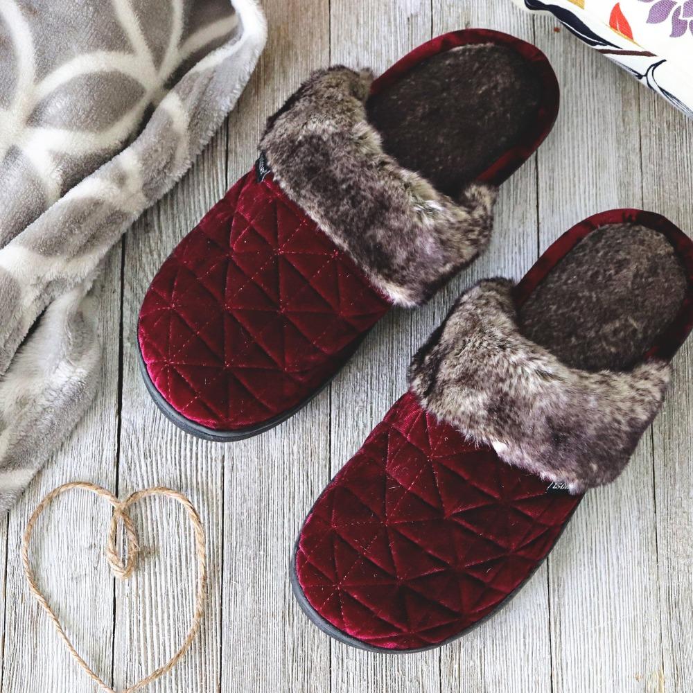 Women's Crushed Velour Stephanie Clog Slippers in Henna Red Laying flat on hardwood floor with cozy blanket