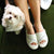 Women's Mother's Day Slide Slippers Ewe (White) Top View quote reads Amazing, Intelligent, Beautiful on model sitting on green couch with small puppy next to her