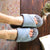 Women's Mother's Day Slide Slippers Ash Grey Top View quote reads Dear Mom, You're the best on model with feet up on coffee table with glass of wine and book