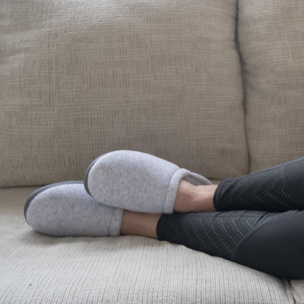 Women's Terry Clog Slippers Navy 6Women's Terry Clog Slippers in Heather on model lying on a couch