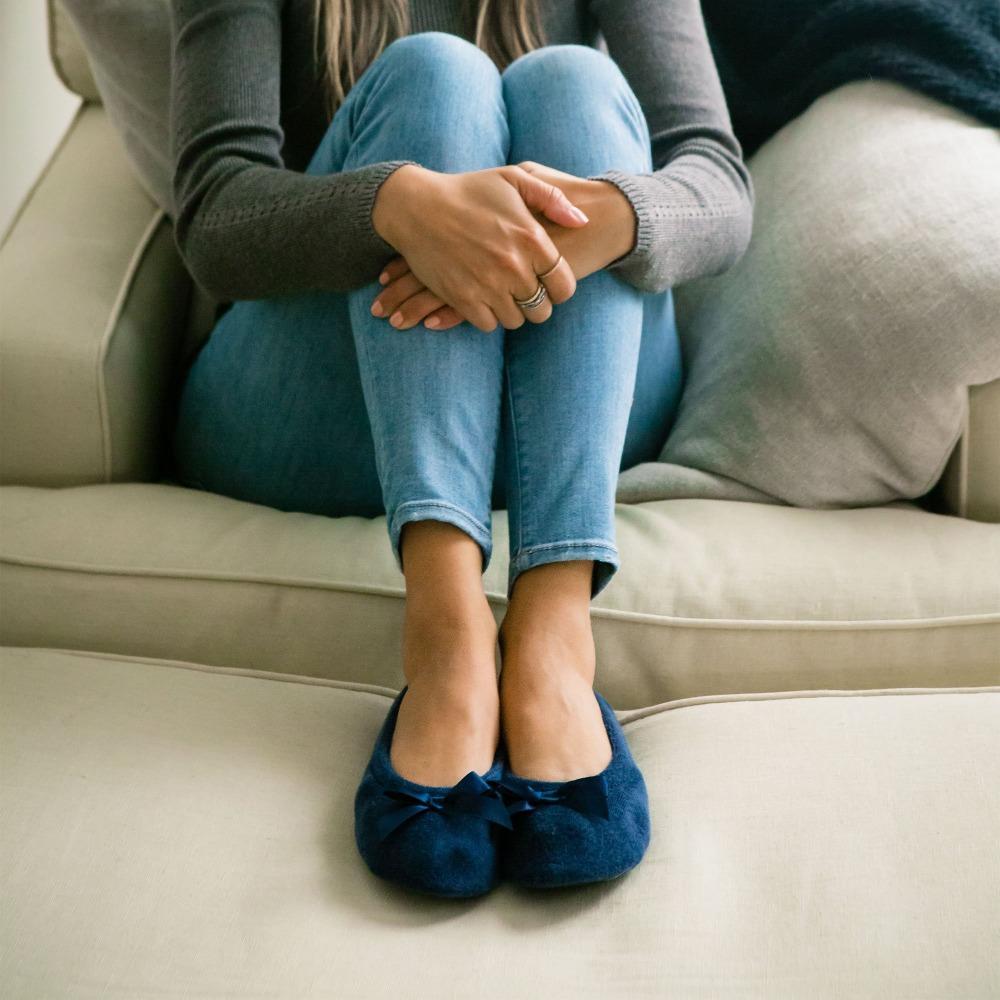 Women's Classic Terry Ballerina Slippers on model sitting on couch