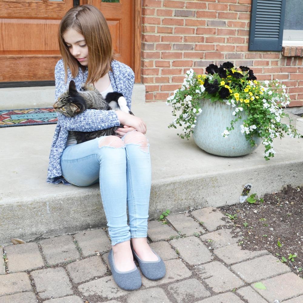 Women's Heathered Jersey Jillian Ballerina Slippers in Grey on Young Model outside with cat in arms