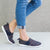 Zenz Women's Balance Slip-On in Navy Blue on figure standing with one foot behind him
